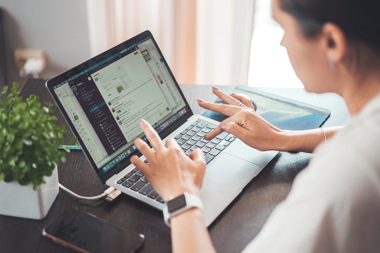 Woman operating her laptop